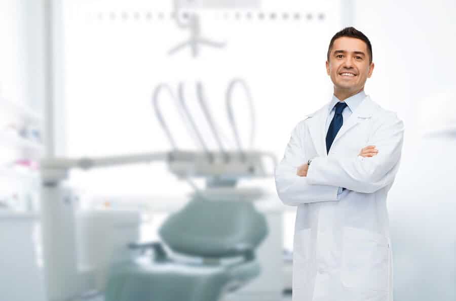 male dentist smiling at the camera