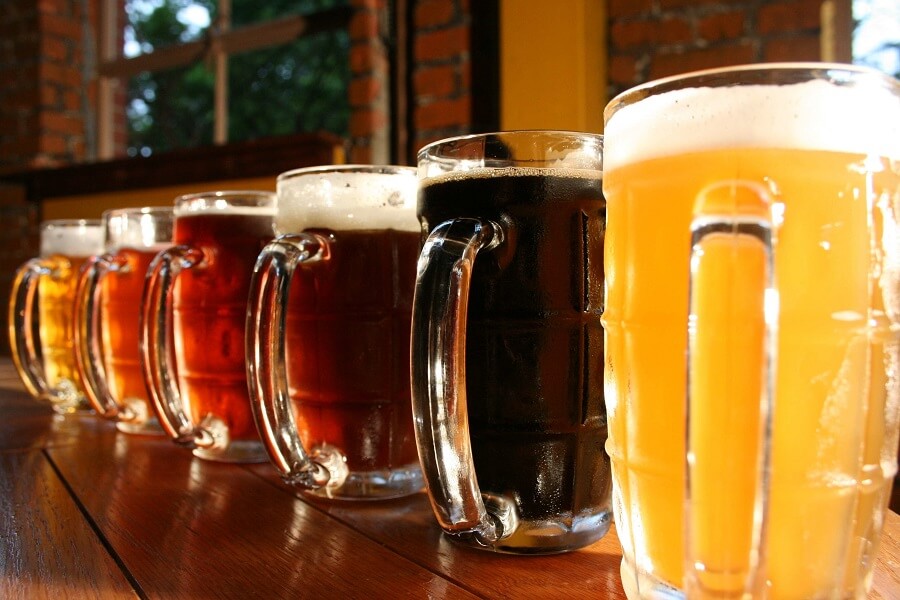 pitchers of different types of beer