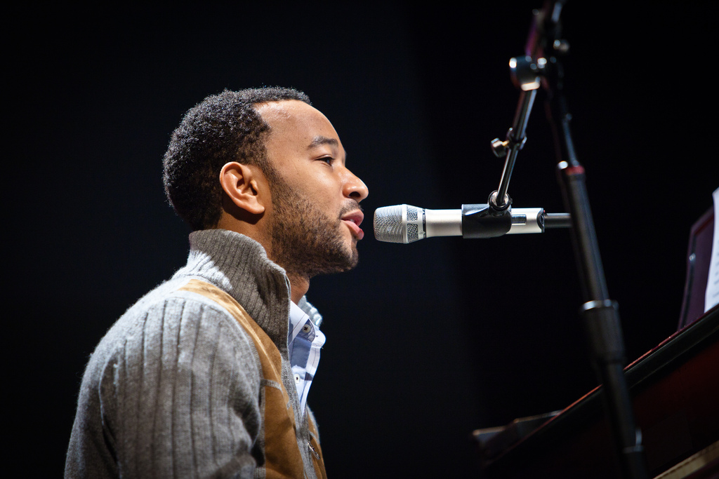 John Legend singing and playing the piano
