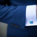 Man wearing a blue suit with a blue cufflinks